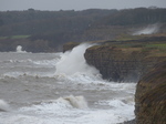 LZ00560 Waves crashing against cliffs at Llantwit Major beach.jpg